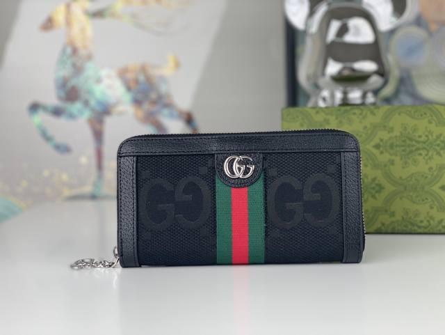 Gucci 新款钱包全拉链式钱包融合品牌颇具辨识度的 素,字母交织图案细节这款钱包由双图案帆布制作而成,匠心运用别致尺寸,散发出一抹现代气息 黑色双g图案帆布